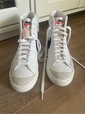 Nike White High-Top Sneakers with black Swoosh